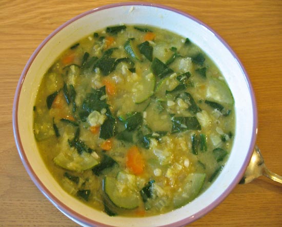 Red lentil soup with spinach and courgettes