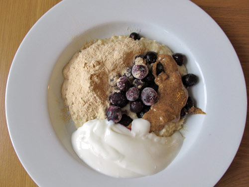 Baobab porridge with blueberries, almond butter and natural yoghurt
