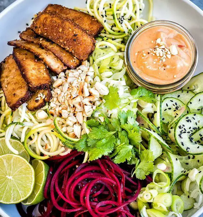 Spiralized vegetable noodles with smoked tofu and spicy peanut sauce