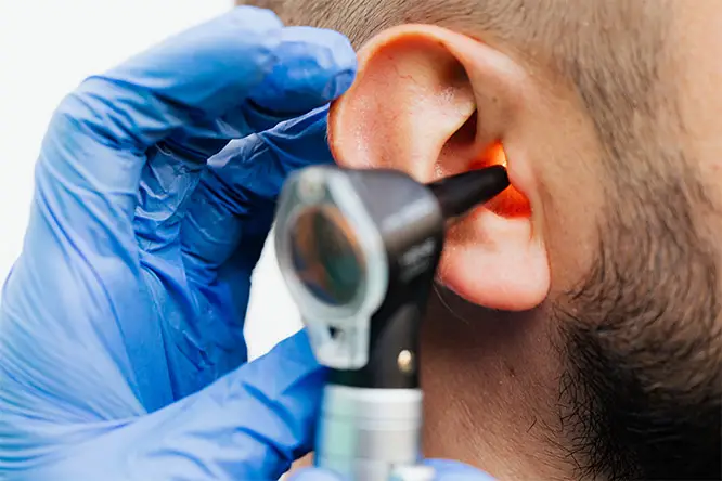 ear specialist checking the ear